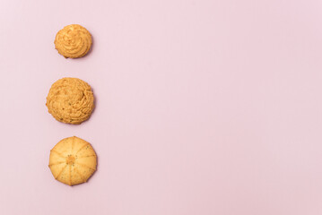 Danish Butter Cookie Assortment on Pink Background Various Pastry Snack Food Minimalism Copy Space