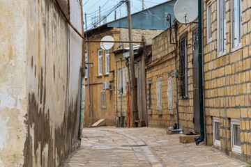 Fototapeta na wymiar street between the ancient quarters in the mahallas of the historical center of Derbent, Dagestan