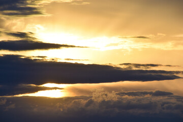 Fototapeta na wymiar Sunset horizon in the evening bright yellow red clouds