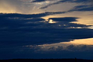 Sunset horizon in the evening bright yellow red clouds
