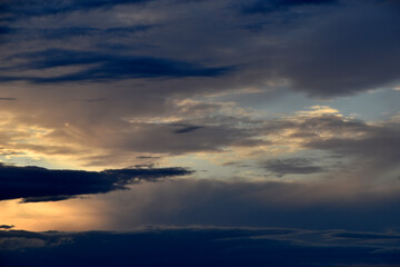Sunset horizon in the evening bright yellow red clouds
