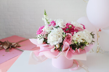 Bouquet of peonies and balloons, greeting card with the holiday. Birthday, Valentine's day, March 8.