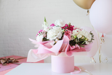 Bouquet of peonies and balloons, greeting card with the holiday. Birthday, Valentine's day, March 8.