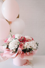Bouquet of peonies and balloons, greeting card with the holiday. Birthday, Valentine's day, March 8.