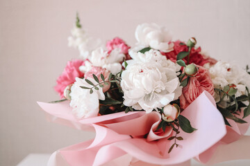 Bouquet of peonies and balloons, greeting card with the holiday. Birthday, Valentine's day, March 8.