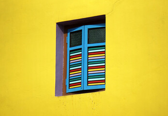 Beautiful classic painted wooden windows in Little India in Singapore.
