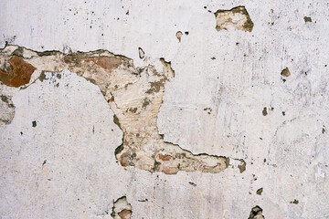 Cracked concrete surface. Background or texture of retro cement brick plaster wall with cracks