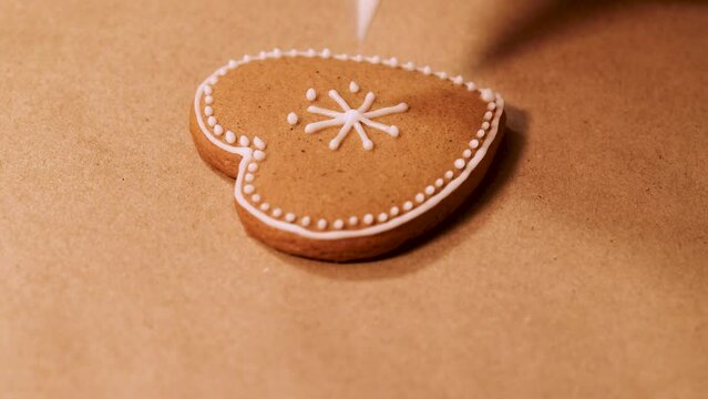Heart-shaped gingerbread cookies decorated with icing patterns. Selective focusing.