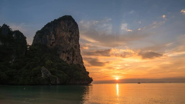 Tropical islands sunset time lapse with ocean sea water and sand beach at Railay Beach, Krabi Thailand nature landscape timelapse