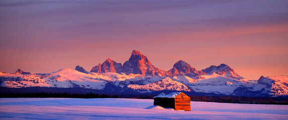 Tetons Mountains Sunset in Winter with Old Cabin Homestead Building