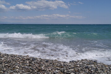 Fototapeta na wymiar Mediterranean sea coast line with pebbles beach and waves