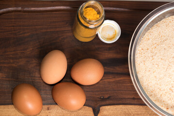 materials for making milanesas, four eggs and breadcrumbs, homemade food, healthy eating, selective focus