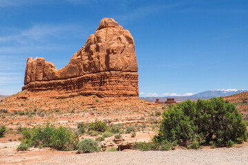 Sandstone rock formation in the Arches National Park, Utah, USA, on a beautiful sunny day of spring. Geological shapes in Utah desert. Travelling in American southwest. La Sal Mountains in the back