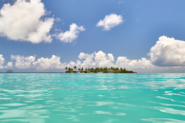 Tropical beach in Maldives. Travel and tourism to luxury resorts in the Maldives islands. Summer holiday concept