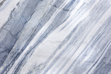 Background image: marble surface with a texture of layers and cracks