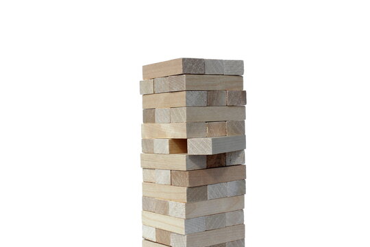 The tower is built from wooden blocks. Jenga game.