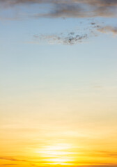 Sunset sky with orange sunrise on blue sky background vertical in the morning.