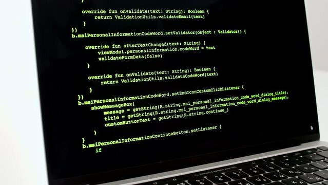 Developer is browsing html code on the computer screen. Scroll of HTML Web Page Code. Programming code abstract technology background. Computer script concept. High quality 4k footage