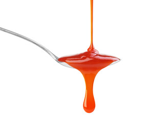 drip of red sauce in a spoon on a white background - obrazy, fototapety, plakaty
