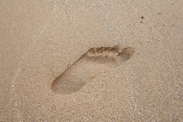 The footprints of the people on the sand