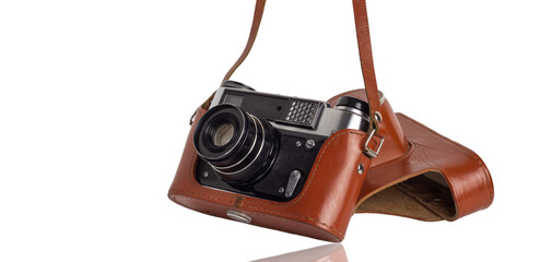 Camera in a vintage case isolated on a white background.