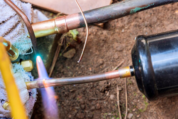 Copper pipe while joining pipe with fitting the central aitr conditioner unit