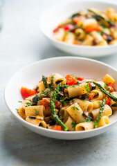 Pasta salad with grilled vegetables, zucchini, eggplant, asparagus and tomatoes.