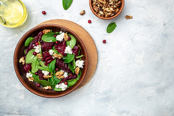Healthy Beet Salad with fresh sweet baby spinach, cheese, nuts, cranberries. Clean eating, dieting,...