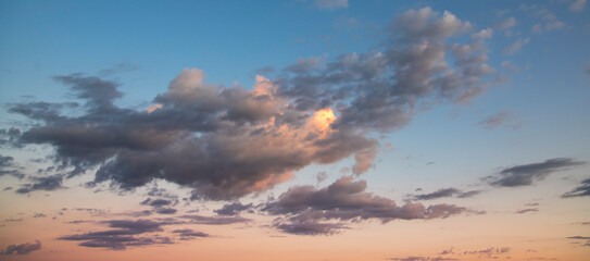 Fototapeta premium Beautiful bright sunrise with clouds. Sky background.