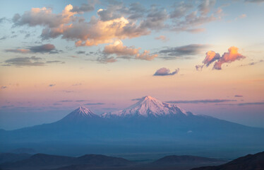Fototapeta na wymiar Panoramic view at the Ararat mountains on the sunrise.