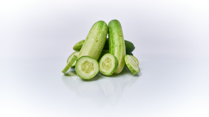 Close-up of fresh young cucumber isolated on a white background