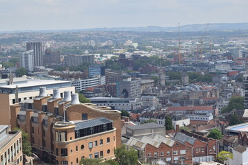 Aerial view of Bristol city during sunny day with sky and clouds.