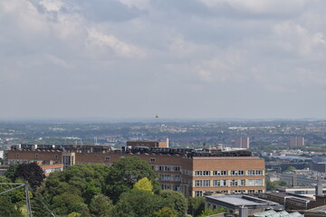 Aerial view of Bristol city during sunny day with sky and clouds.