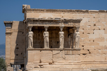 Obraz premium Colonnade of the caryatids in the Acropolis of Athens, Greece, during a sunny summer day