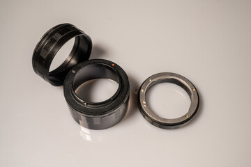 Macro rings for the camera located on a white surface. Isolate, Copy Space.
