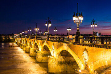 Fototapeta na wymiar Old stony bridge in Bordeaux