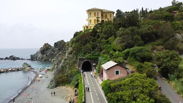 Europe, Italy , Liguria , Drone aerial view of Levanto Bonassola Framura cycle  pedestrian path - old galleries tunnels  in the rock by the sea - tourist attraction in the Cinque Terre
