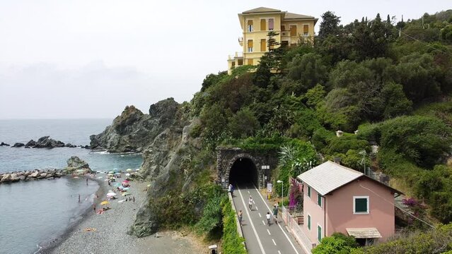 Europe, Italy , Liguria , Drone aerial view of Levanto Bonassola Framura cycle  pedestrian path - old galleries tunnels  in the rock by the sea - tourist attraction in the Cinque Terre