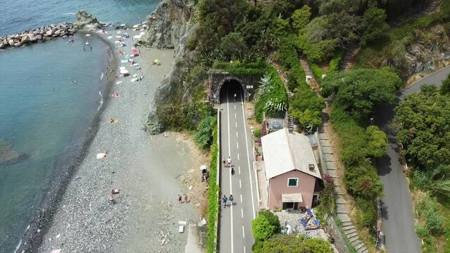 Europe, Italy , Liguria , Drone aerial view of Levanto Bonassola Framura cycle  pedestrian path - old galleries tunnels  in the rock by the sea - tourist attraction in the Cinque Terre