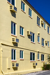 Fototapeta premium Yellow building with Air Conditioners 