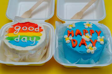 Two bento cake box blue cake with daisies, happy day inscription. and with rainbow lettering good...