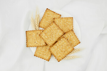 Crispy cracker according to recipes. Sweet cookies on a bun background