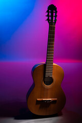Classical guitar on a colourful background with copy space