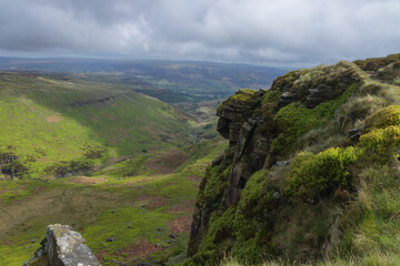 Looking down from Laddow Rocks as the sun teases the valley below between rain showers