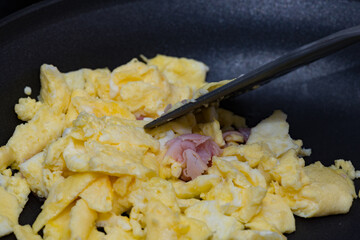 Closeup of scrambled eggs with a shallow depth of field