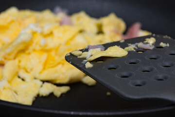 Closeup of scrambled eggs with a shallow depth of field
