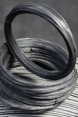 Iron wire in roll. Warehouse of metal products. Close-up