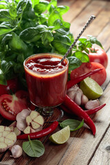 Homemade tomato sauce and ingredients.