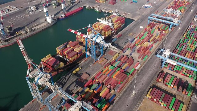 Cargo ship at Ashdod port ready to unload containers, aerial
Drone view from , Israel, Ashdod,June,07,2022, freight shipping concept
