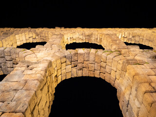Night photo of the aqueduct of Segovia in a summer night, Spain.